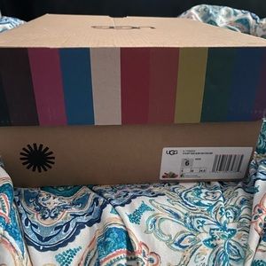 Size 6 never worn ugg slippers rainbow color